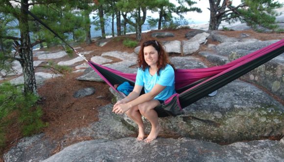 Svetlana sitting in a hammock on Stone Mountain