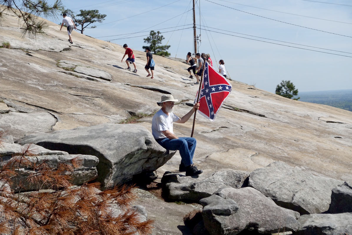 Man with confederate flag on Stone Mountain