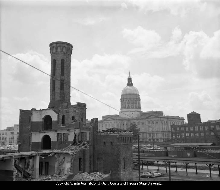 "Fulton Tower with the State Capitol in the background during demolition, 1962" AJCN052-102a, Atlanta Journal-Constitution Photographic Archives. Special Collections and Archives, Georgia State University Library.